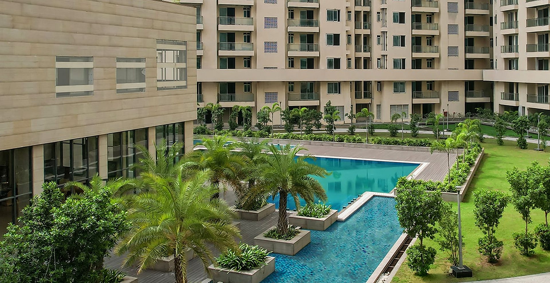 Palm-lined pool garden between the towers (actual image)