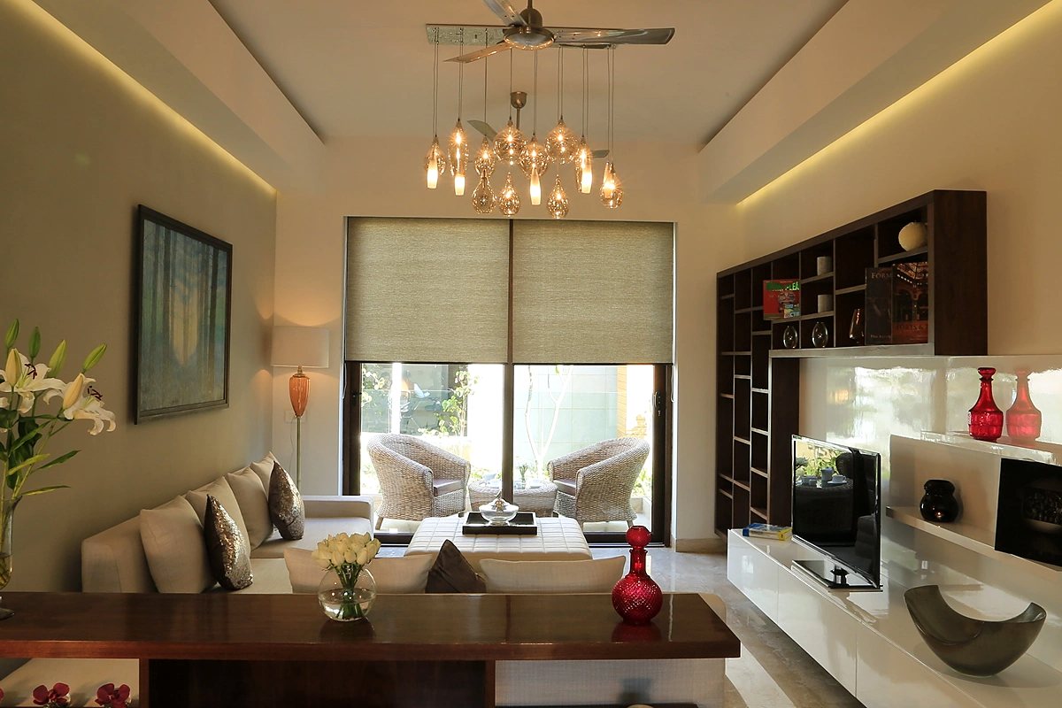 Living room with a media wall in the sample flat